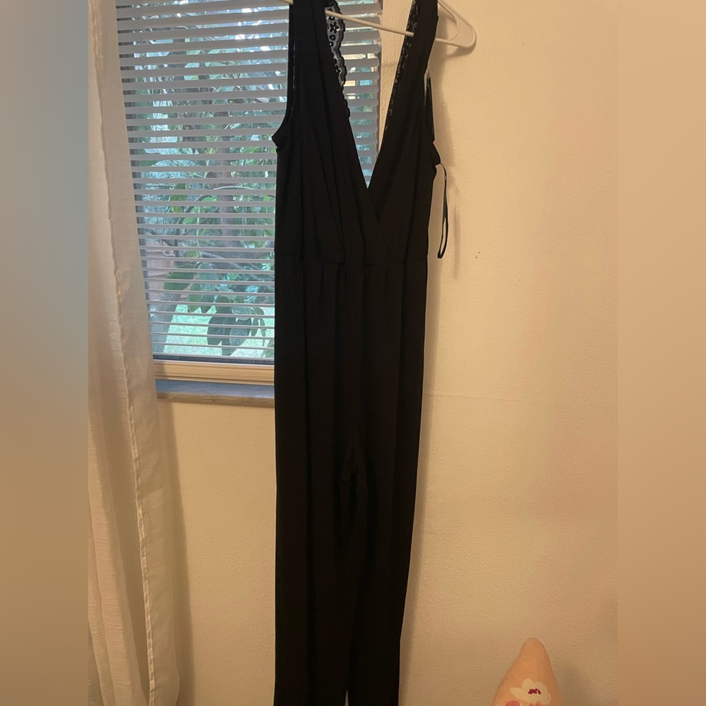 Never worn romper. - Picture 1 of 3